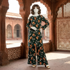 Model wearing a dark green floral printed 2-piece cotton silk unstitched suit by ZH2 Store."