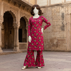 "Mannequin showcasing a vibrant pink 2-piece cotton silk unstitched suit with floral pattern, available at ZH2 Store."