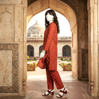"A mannequin wearing a red-colored, traditional floral printed 2-piece cotton silk unstitched suit, available at ZH2 Store."