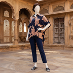 tylish navy blue baggy shirt with oversized floral print, showcased on a mannequin in a heritage architectural setting.