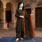 A mannequin displaying the traditional printed lawn suit with a striking orange border dupatta.