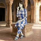 "Woman wearing a premium cotton-silk unstitched 2-piece suit with vibrant floral prints from ZH2 Store."