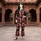 "A mannequin wearing a dark-based floral print 2-piece cotton silk unstitched suit, available at ZH2 Store."