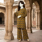 "Woman wearing a mustard and charcoal heart-printed 2-piece unstitched cotton suit"