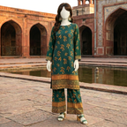 Full-length front standing view of the emerald green printed 2-piece unstitched cotton lawn suit from ZH2 Store, showcasing the elegant drape and chunri border details.