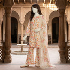A mannequin standing and showcasing the intricate floral pattern of the 3-piece lawn suit.