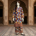 Mannequin displaying a maroon 2-piece unstitched suit with floral pattern and chunri border, premium cotton silk fabric, front view.