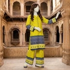 Side standing view of the lime yellow 2-piece unstitched cotton lawn suit from ZH2 Store, showcasing the elegant fit and sleeve detailing.
