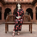 "A mannequin wearing a dark-based floral print 2-piece cotton silk unstitched suit, available at ZH2 Store."