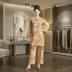 The standing pose with the hand on the hip shows off the fit, drape, and confidence of the outfit beautifully as a hook
