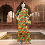 "Woman standing wearing multicolour floral print cotton-silk unstitched 2-piece suit from ZH2 Store."