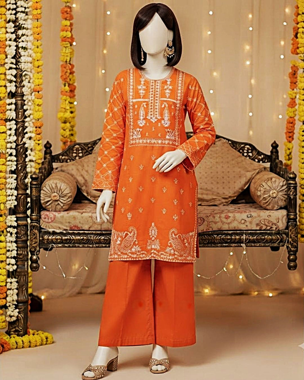 Vibrant orange 2-piece unstitched embroidered lawn suit with matching trousers displayed on a mannequin.