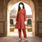 "A mannequin wearing a red-colored, traditional floral printed 2-piece cotton silk unstitched suit, available at ZH2 Store."