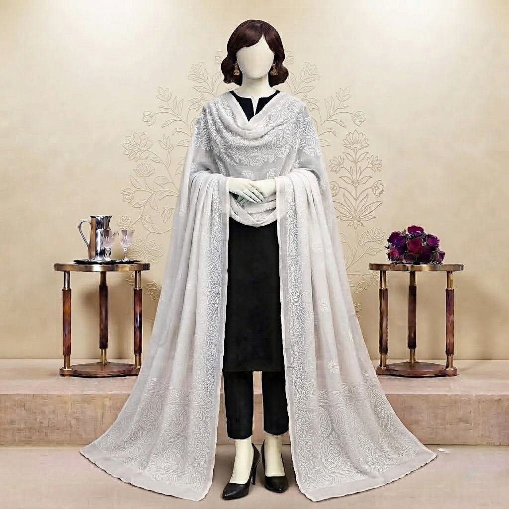 Mannequin styled in a black outfit with a traditional white-on-white embroidered 2.3-meter chaddar