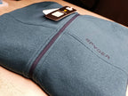A close-up view of the premium fabric and zipper detail on the grayish blue hoodie from ZH2 Store.