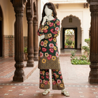 Mannequin wearing a dark green floral 2-piece unstitched suit with decorative chunri border, styled in a traditional architectural setting.