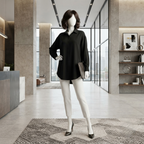 A mannequin wearing a sophisticated black silk formal shirt and white tailored trousers, styled for a professional office environment.