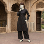 Detailed view of black cotton unstitched suit fabric with colorful dots, ideal for casual and semi-formal wear.