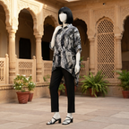 Trendy black and white abstract print baggy shirt, worn by a mannequin in a bright outdoor environment.