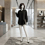 A mannequin wearing a sophisticated black silk formal shirt and white tailored trousers, styled for a professional office environment.