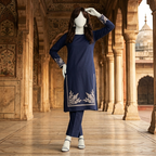 Premium 2-piece embroidered unstitched lawn suit collection by ZH2 Store, featuring a 1.2-meter embroidered shirt and 2.2-meter trouser fabric with intricate ethnic designs displayed on a mannequin.
