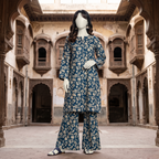 Front view of a mannequin showcasing a deep teal blue leaf-patterned 3-piece unstitched lawn suit at ZH2 Store.