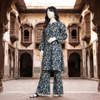 Side view of the teal blue unstitched lawn suit, highlighting the sophisticated leaf-print pattern by ZH2 Store.