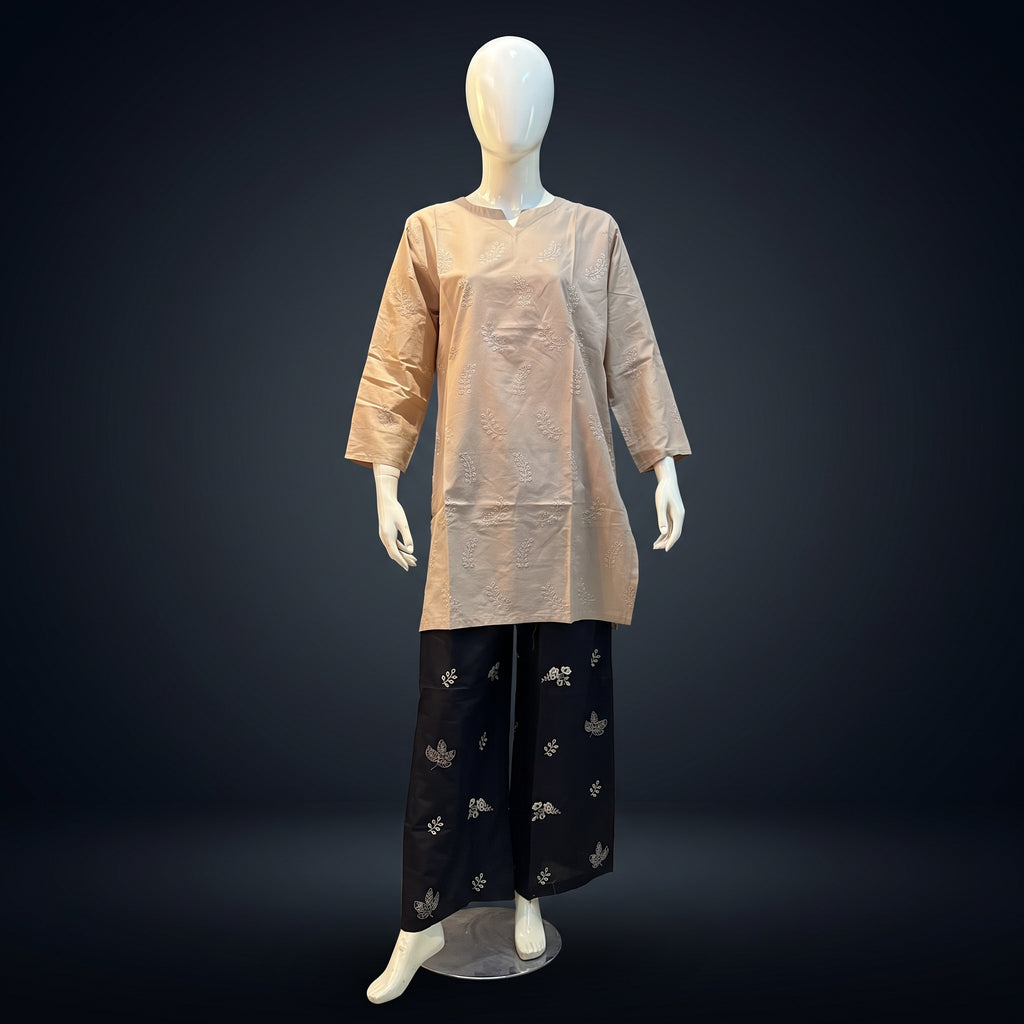 Women's beige embroidered cotton kurti with dark brown wide-leg trousers on mannequin