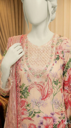 Mannequin wearing a floral dress with a soft focus background