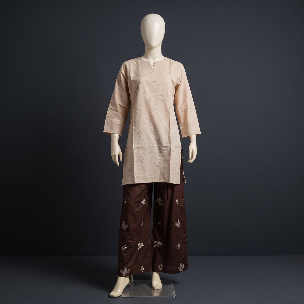 A two-piece traditional outfit displayed on a white mannequin against a dark gray studio background. The set includes a light beige long-sleeve kurta with a split neckline and matching beige trousers, paired with dark brown wide-leg pants featuring a small beige floral pattern.