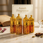 A single golden luxury Attar bottle paired with its signature blue embossed velvet protective travel pouch.